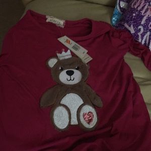 A pink long sleeve shirt